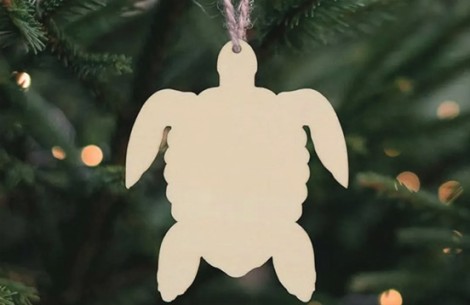 a white turtle shaped ornament from a string