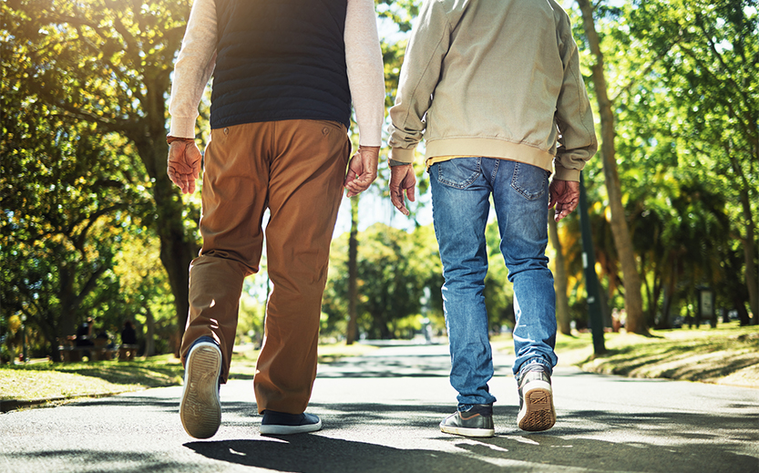 two men walking on a path