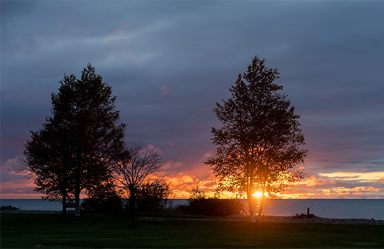 a sunset over a body of water