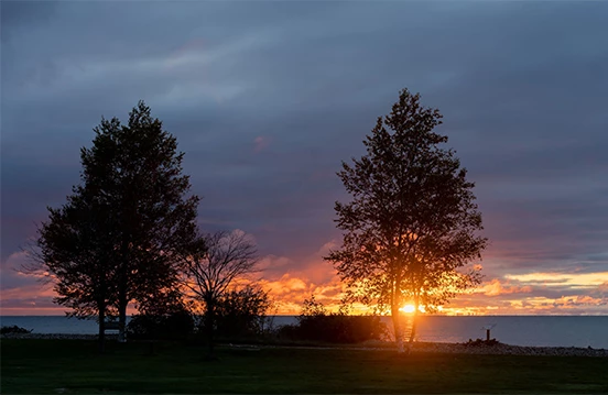 a sunset over a body of water