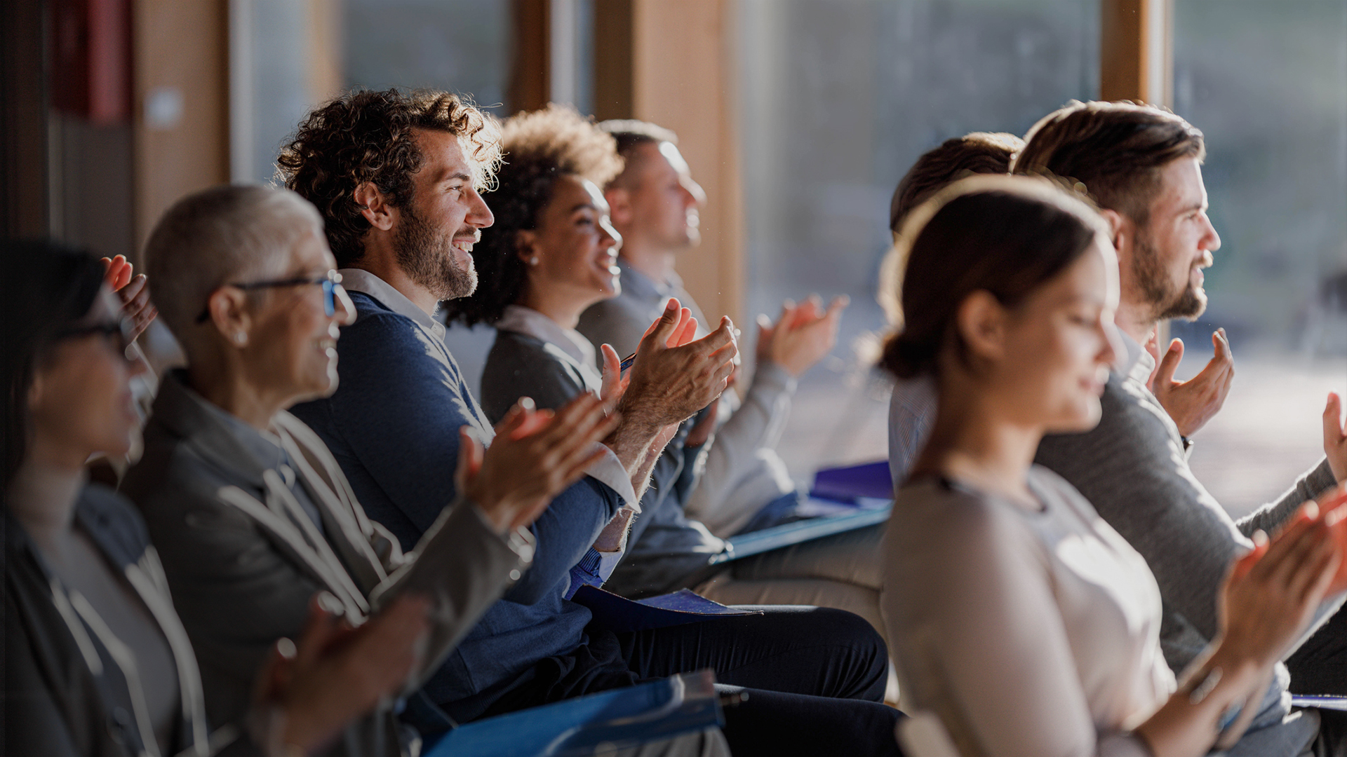 a group of people clapping