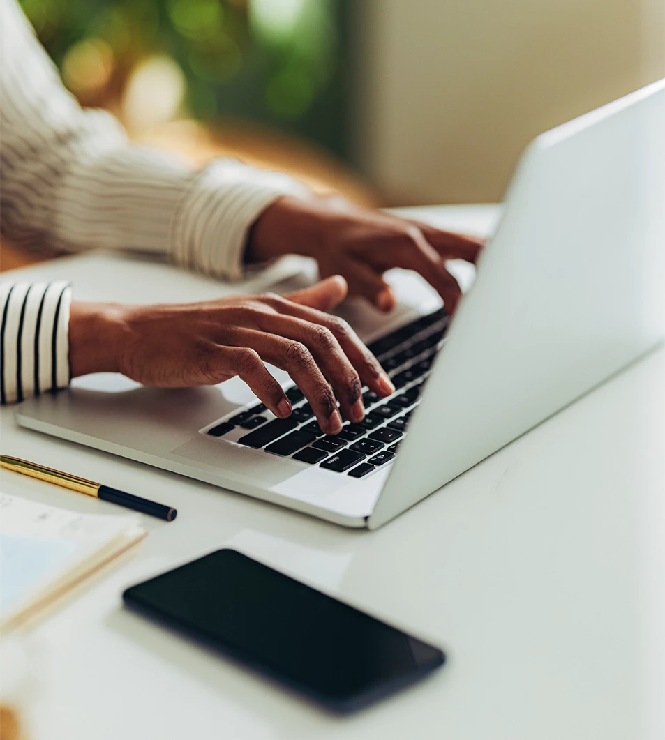 a person typing on a laptop