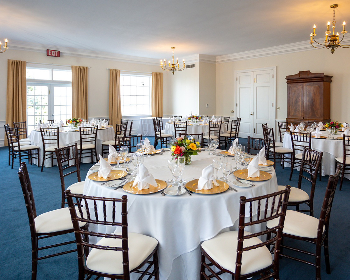 a room with tables and chairs