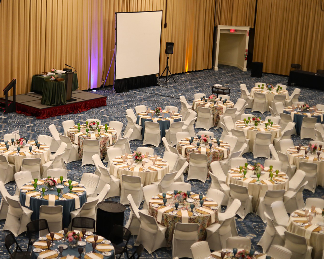 a large room with tables and chairs