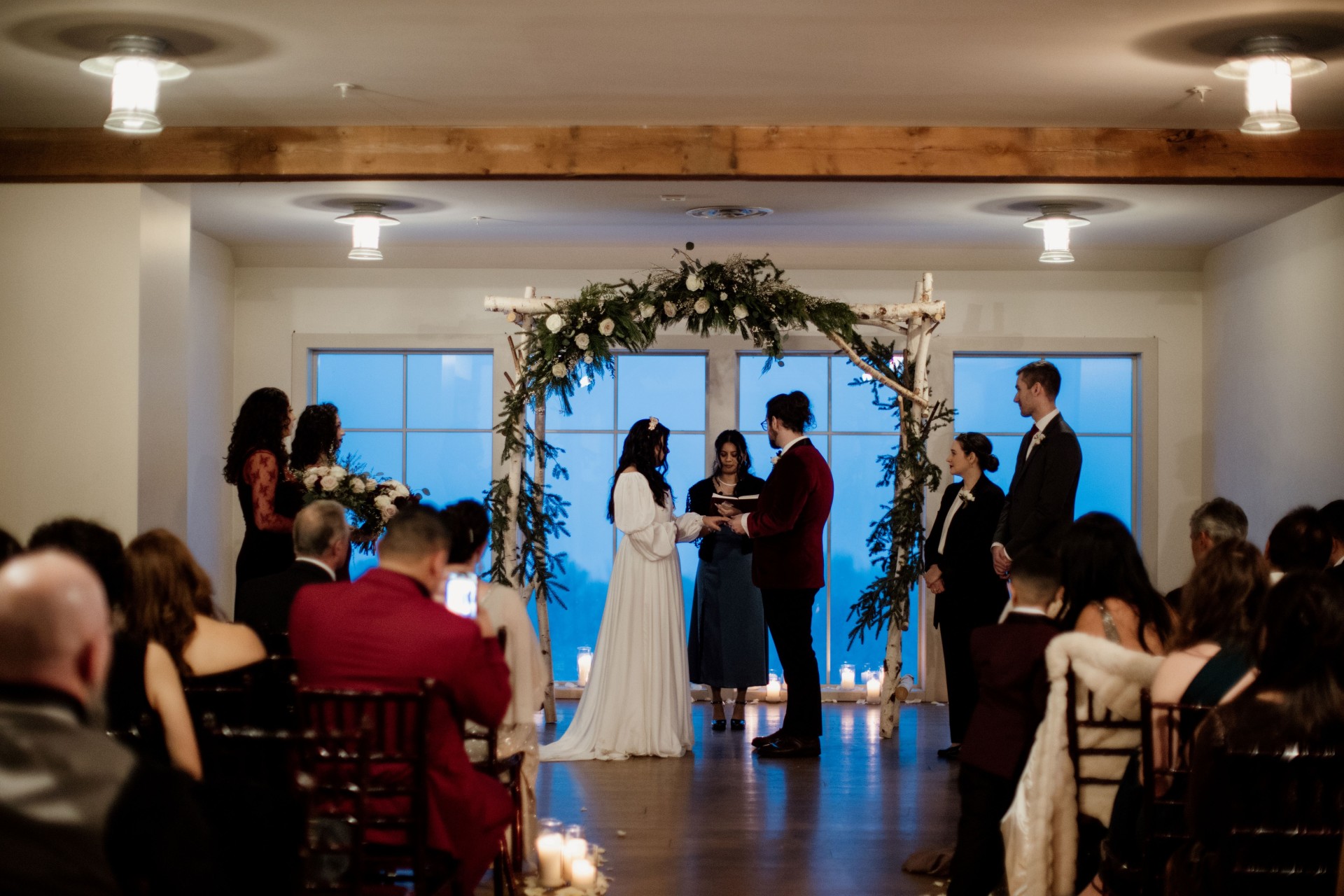 a group of people in a room for a wedding ceremony by Our Two Hearts