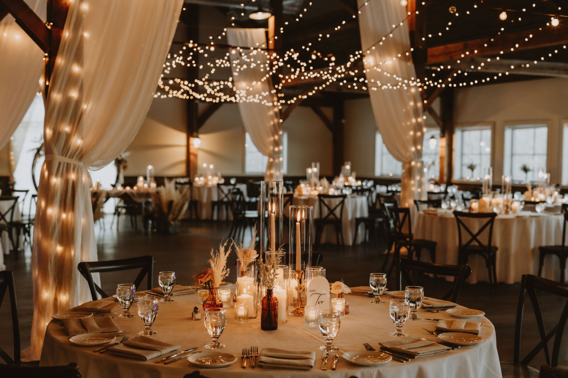 a table set for a wedding reception by Mountain Hearts Photography