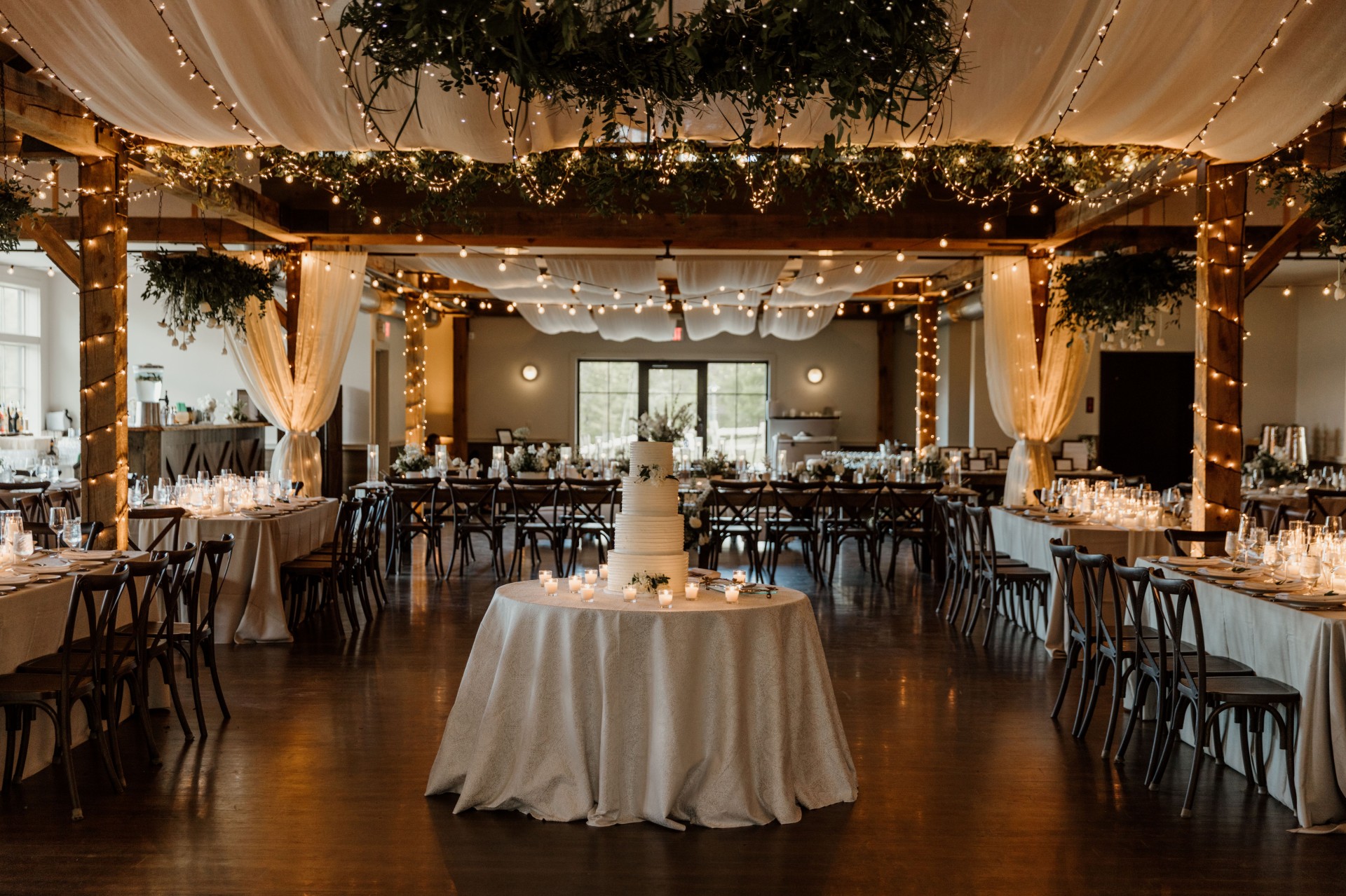 a wedding reception with tables and chairs