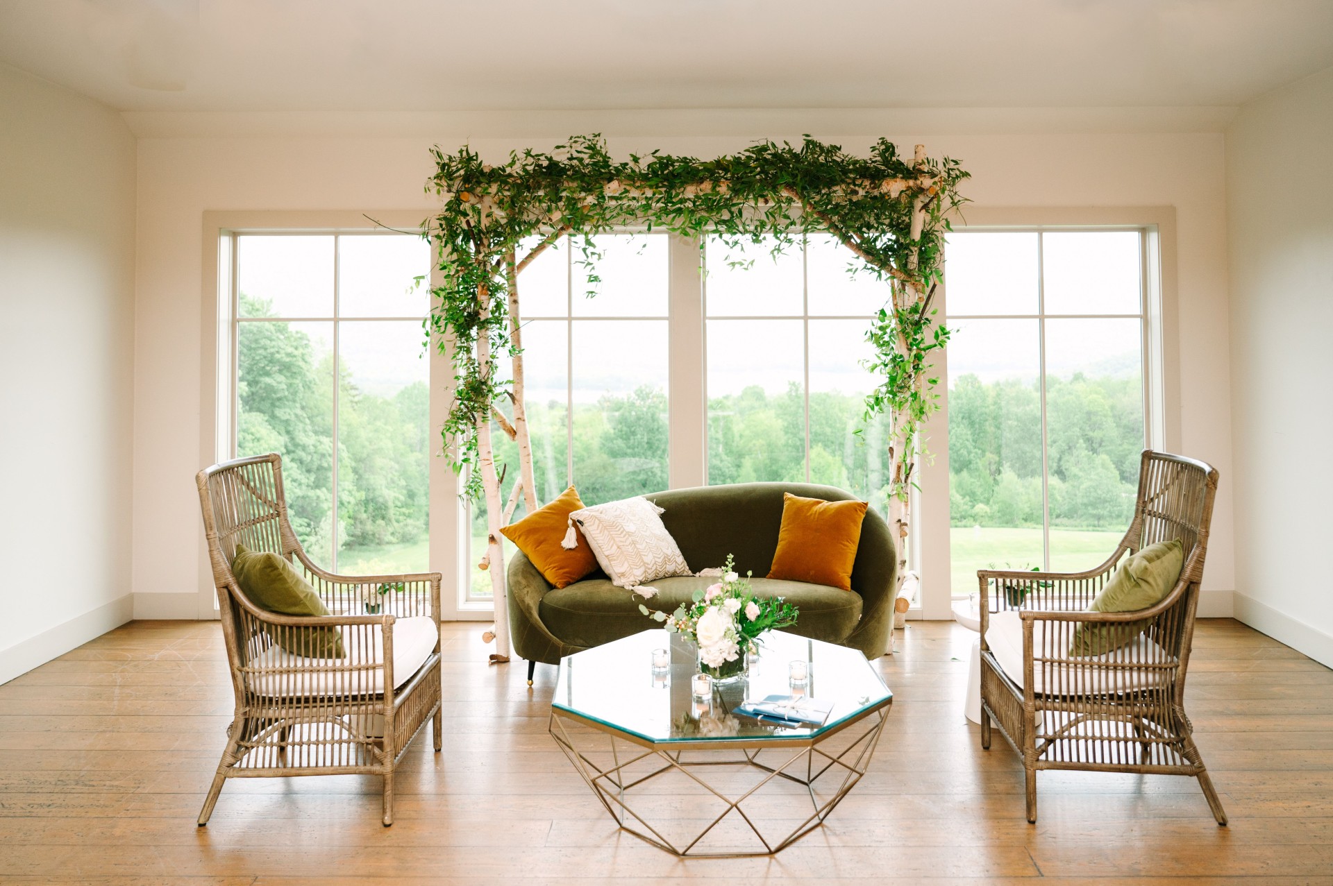 a room with a couch and chairs