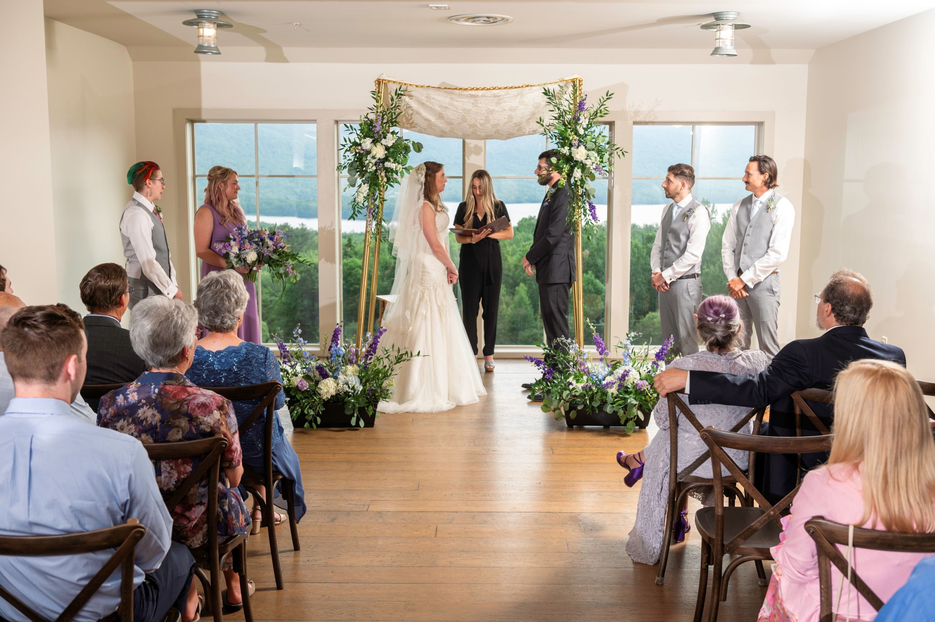 a bride and groom in a wedding ceremony photo by Juniper Studios