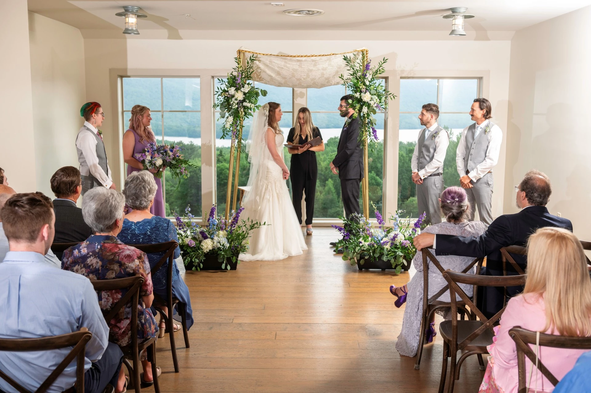 a bride and groom in a wedding ceremony photo by Juniper Studios