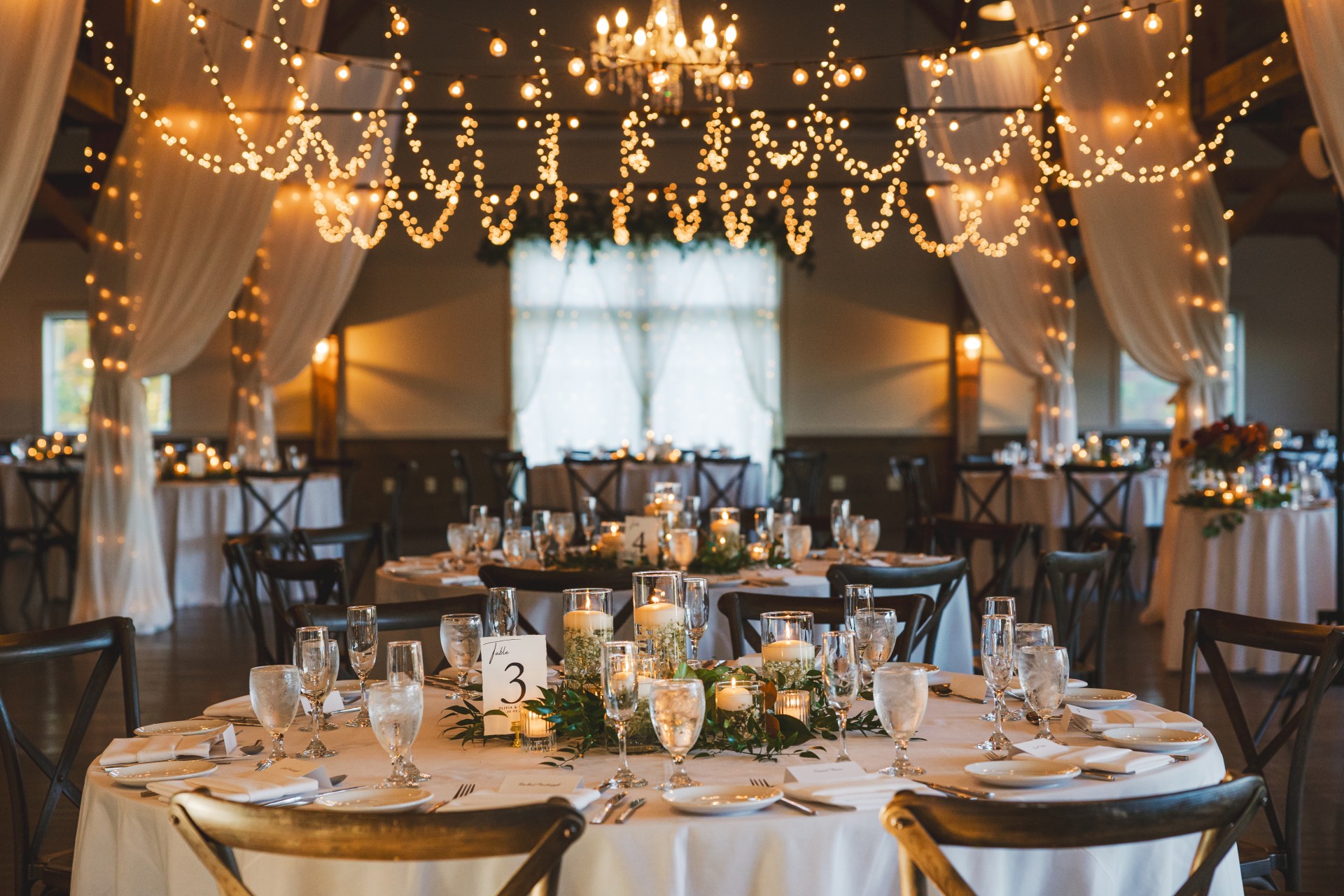 a table set for a wedding reception by Garren Tee Photography