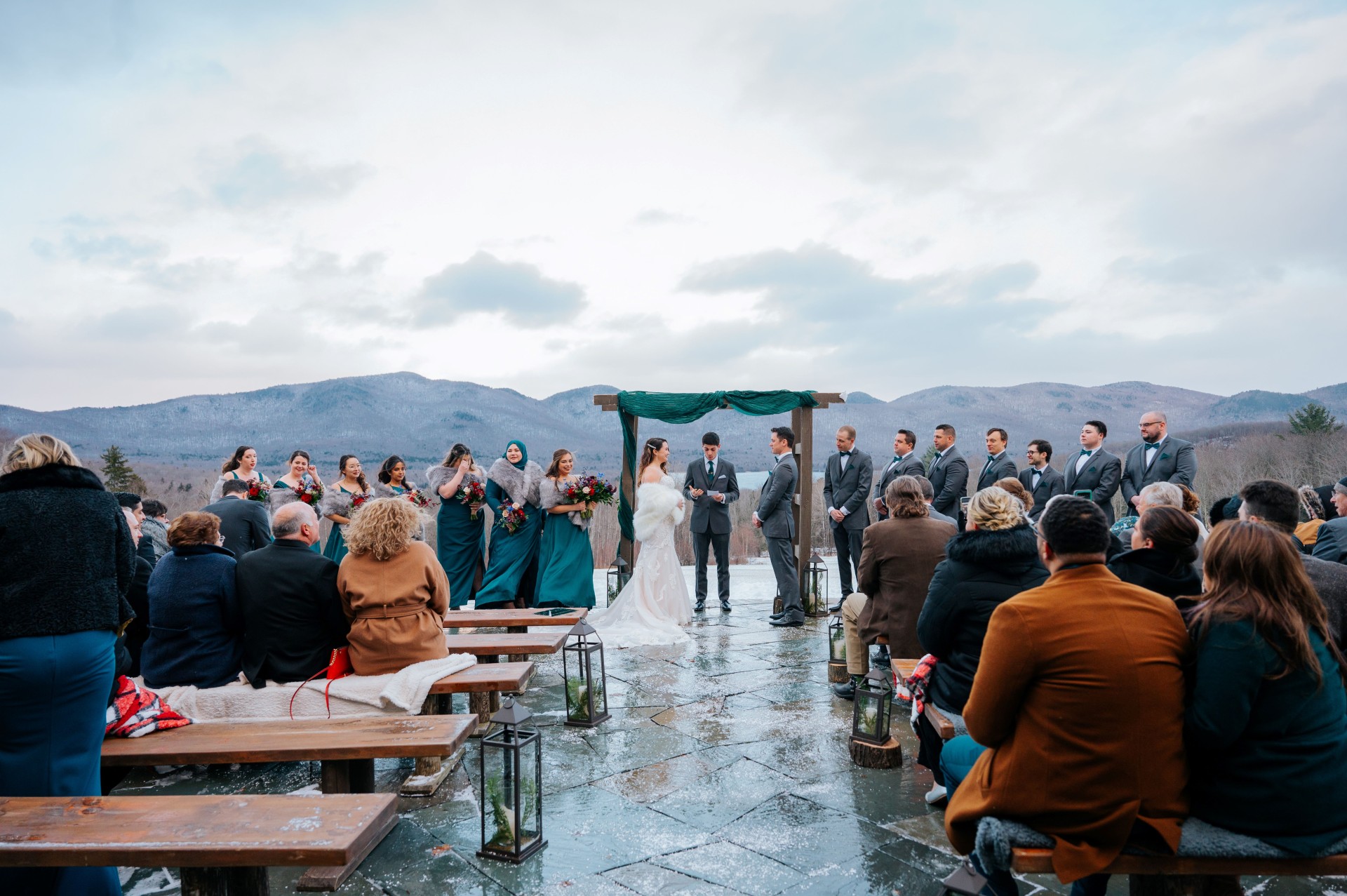 a bride and groom under a canopy at a wedding ceremony