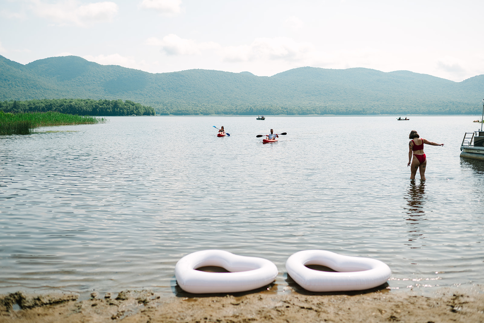 a group of people in kayaks on a lake