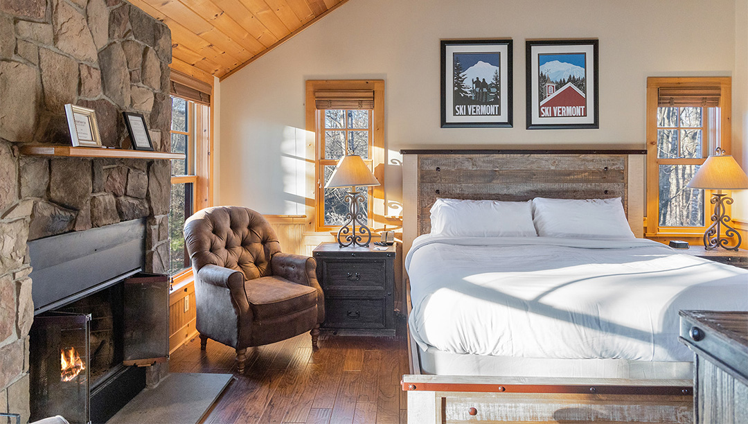 a bedroom with a bed and a chair