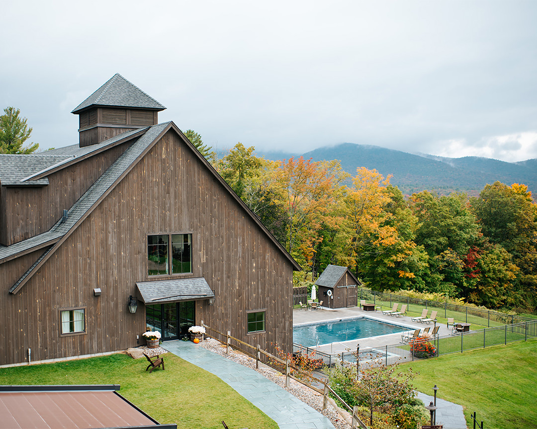 a building with a pool in the back