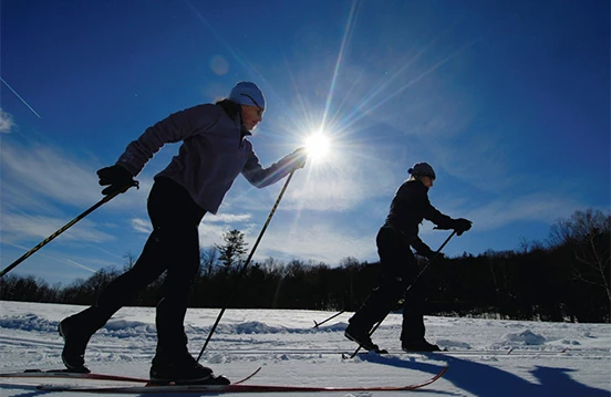 a group of people skiing on snow