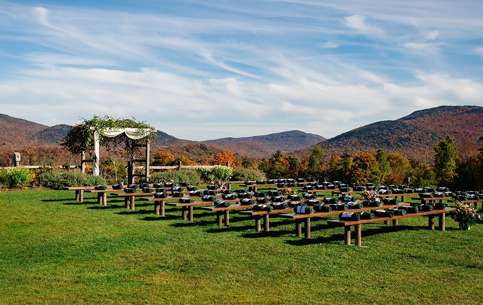 a group of benches in a field