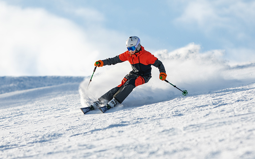 a person skiing down a snowy hill