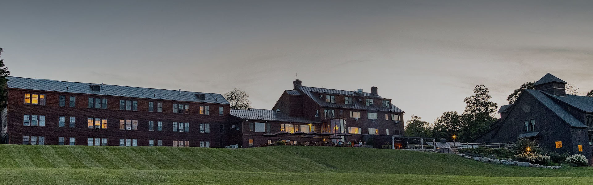 a large building with a lawn and a large building