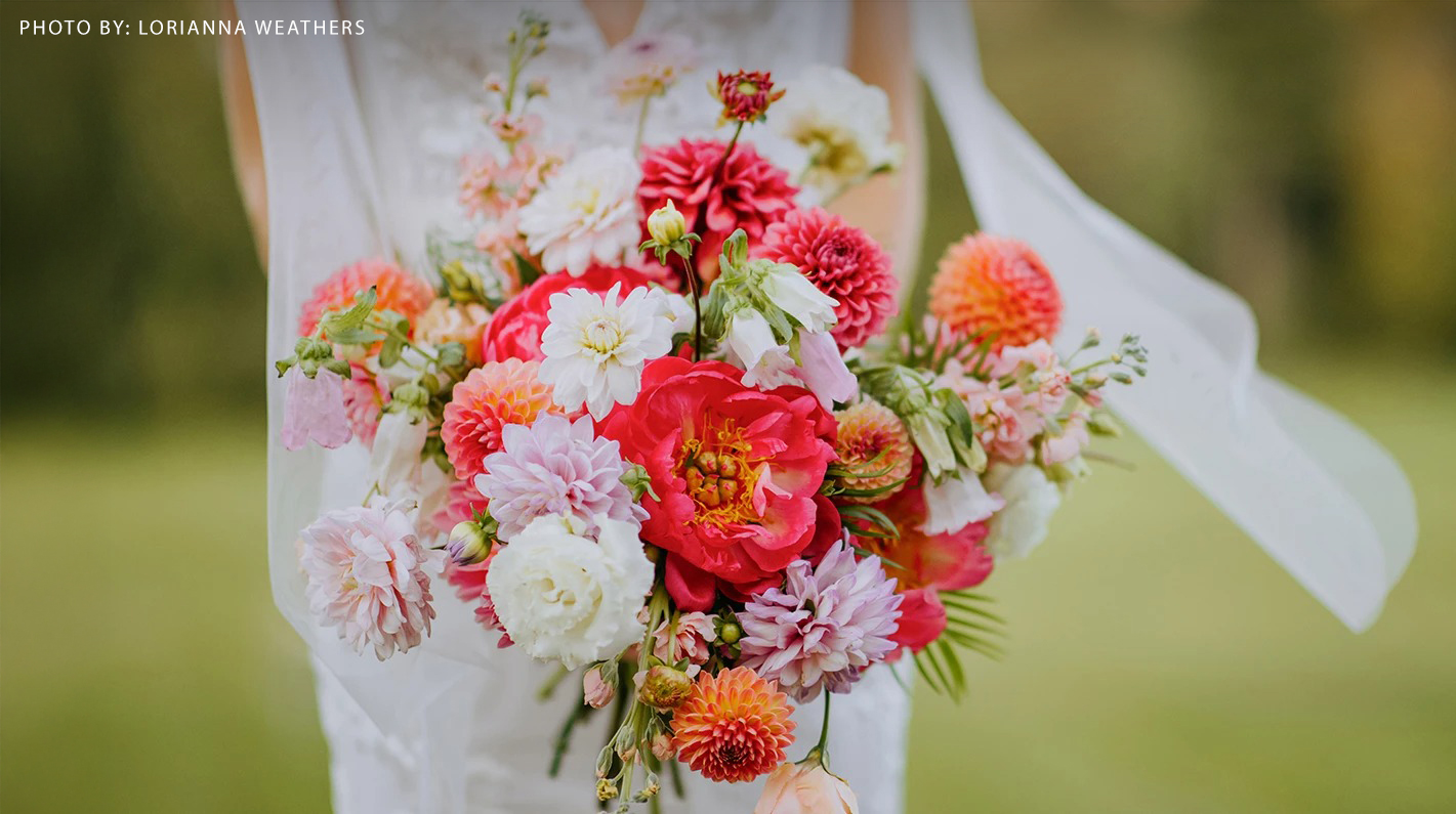 a person holding a bouquet of flowers