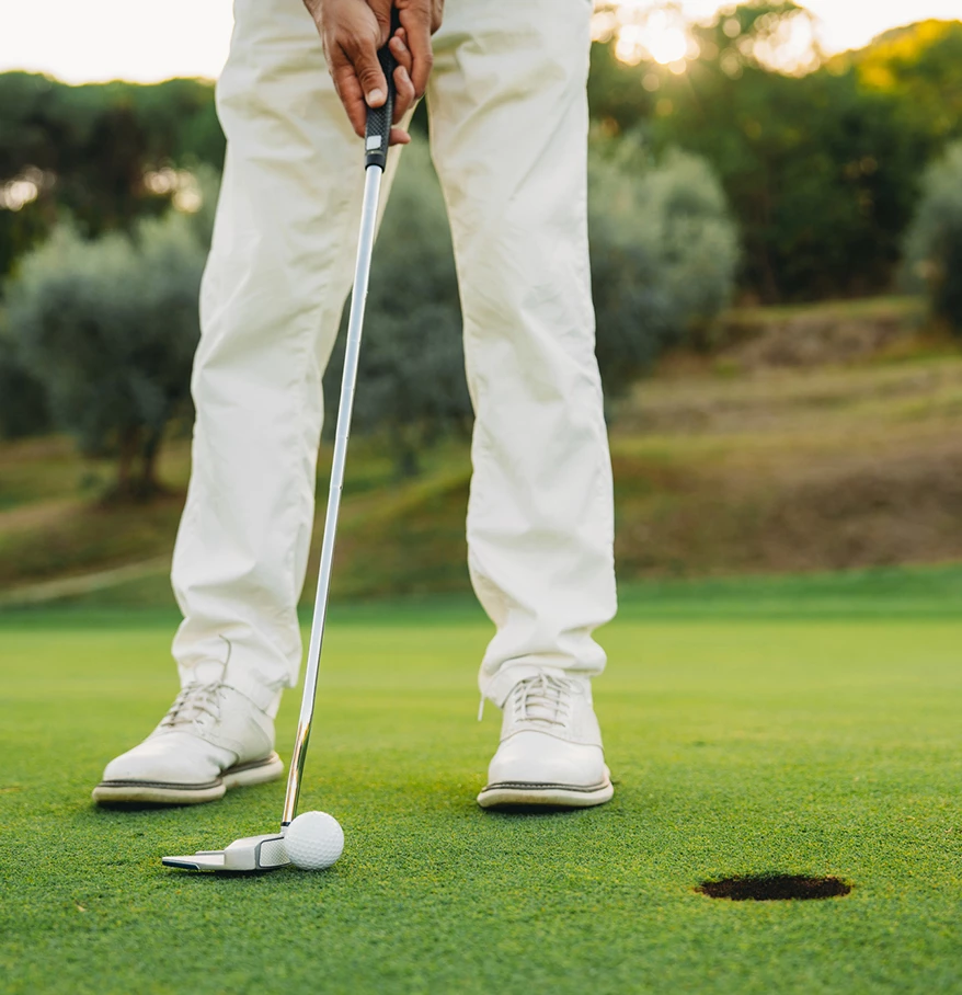 a person holding a golf club