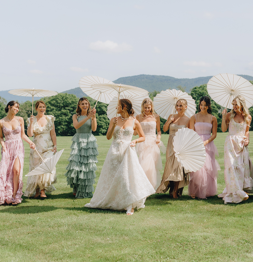a group of women holding umbrellas