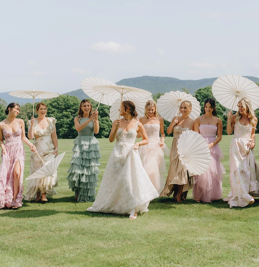 a group of women holding umbrellas