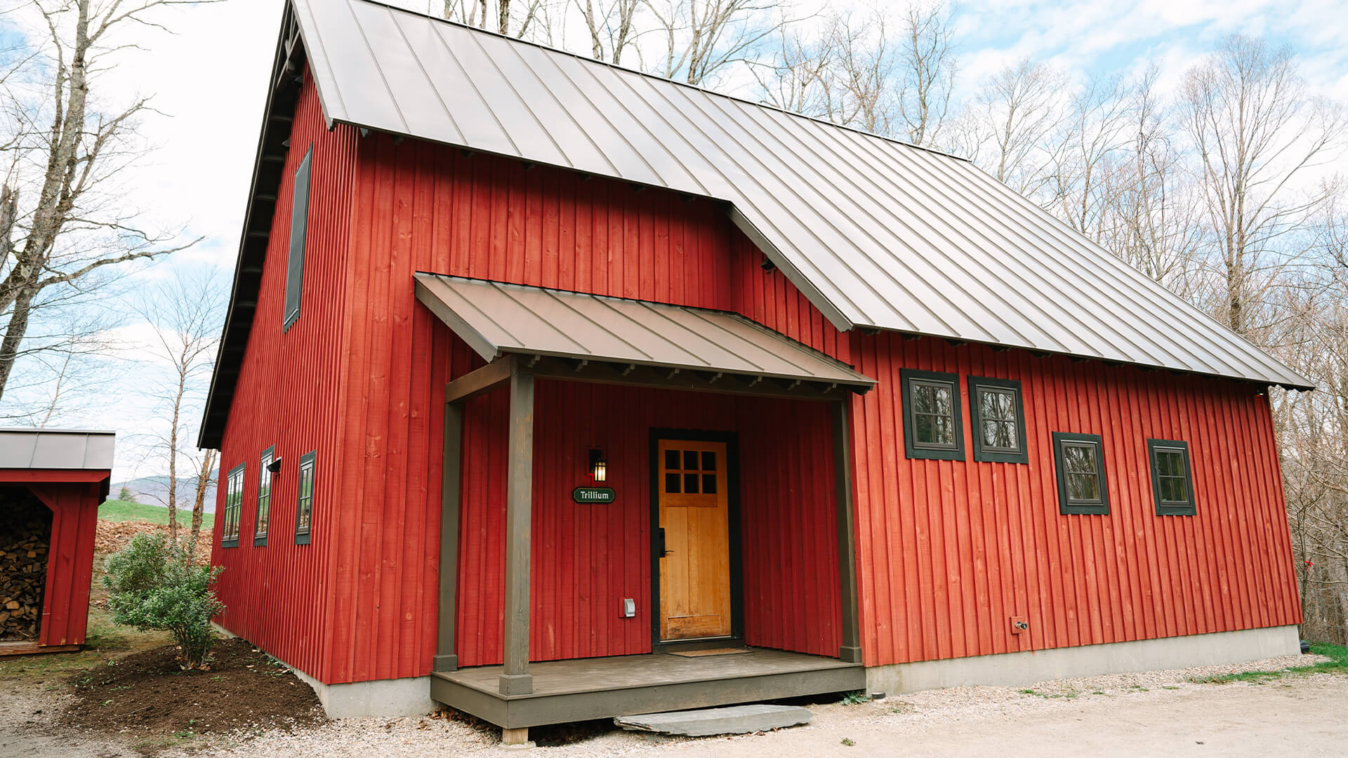 a red house with a door and a porch