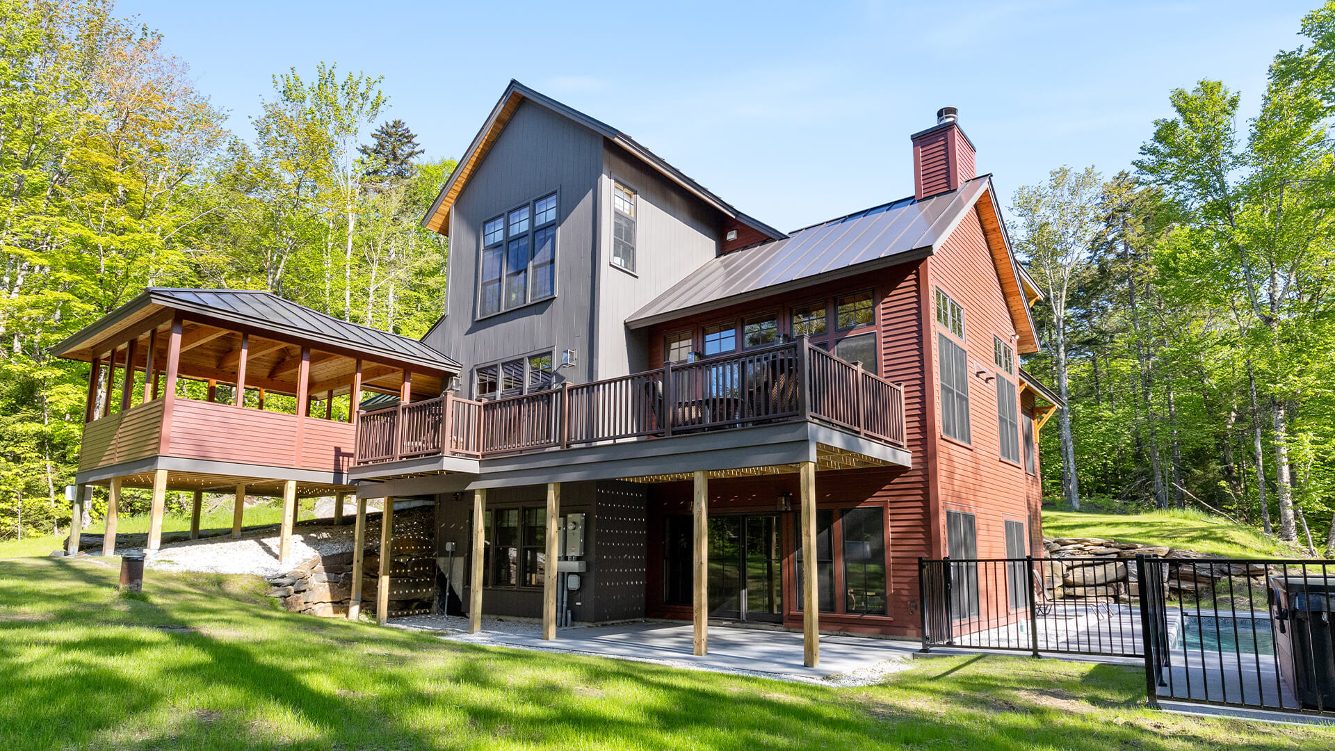 a house with a large porch and a fence