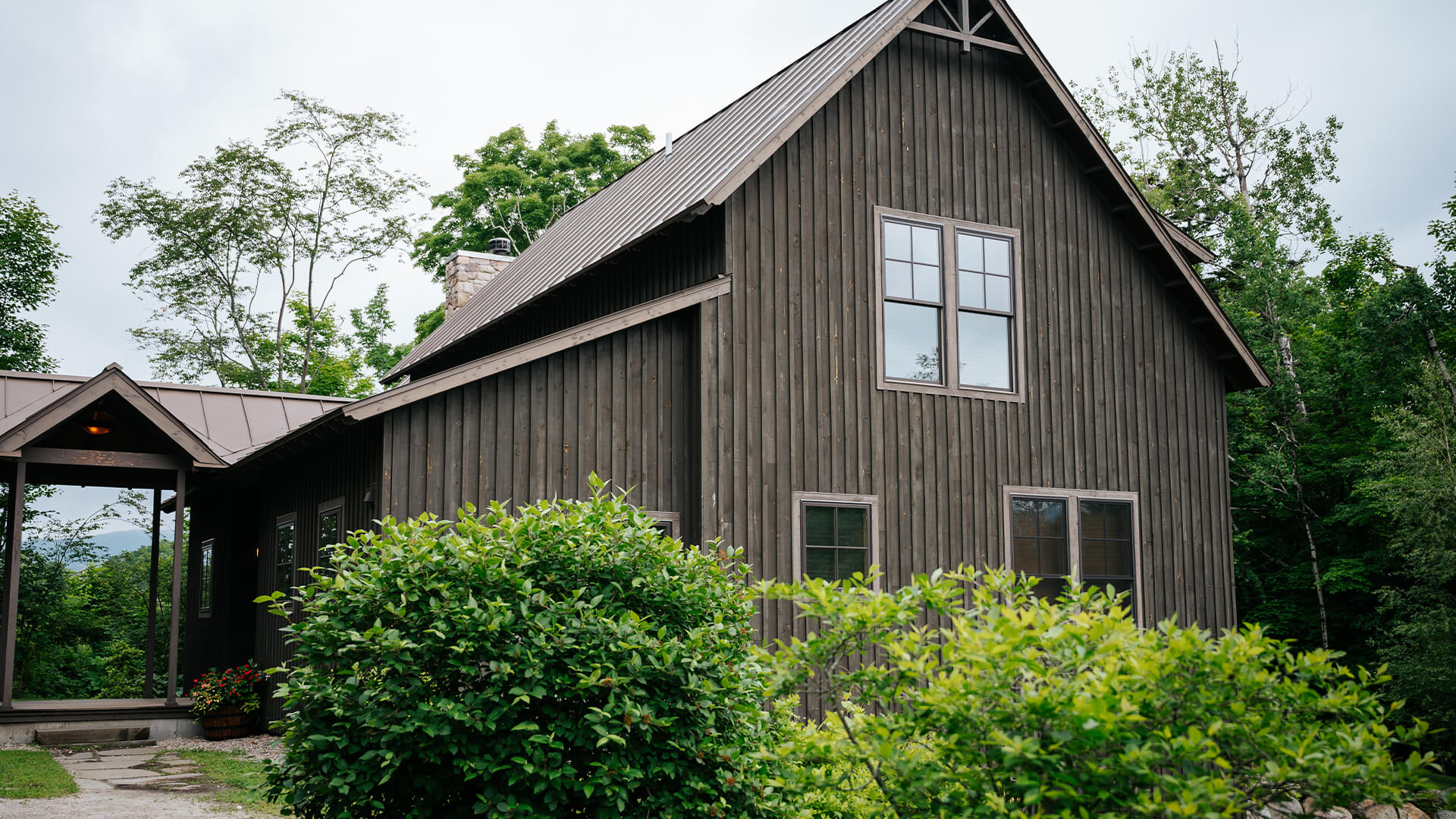 a house with trees around it with Eudora Welty House in the background