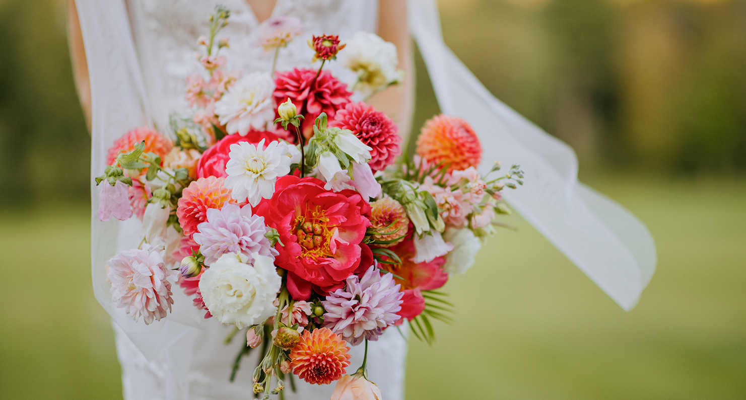 a woman holding a bouquet of flowers