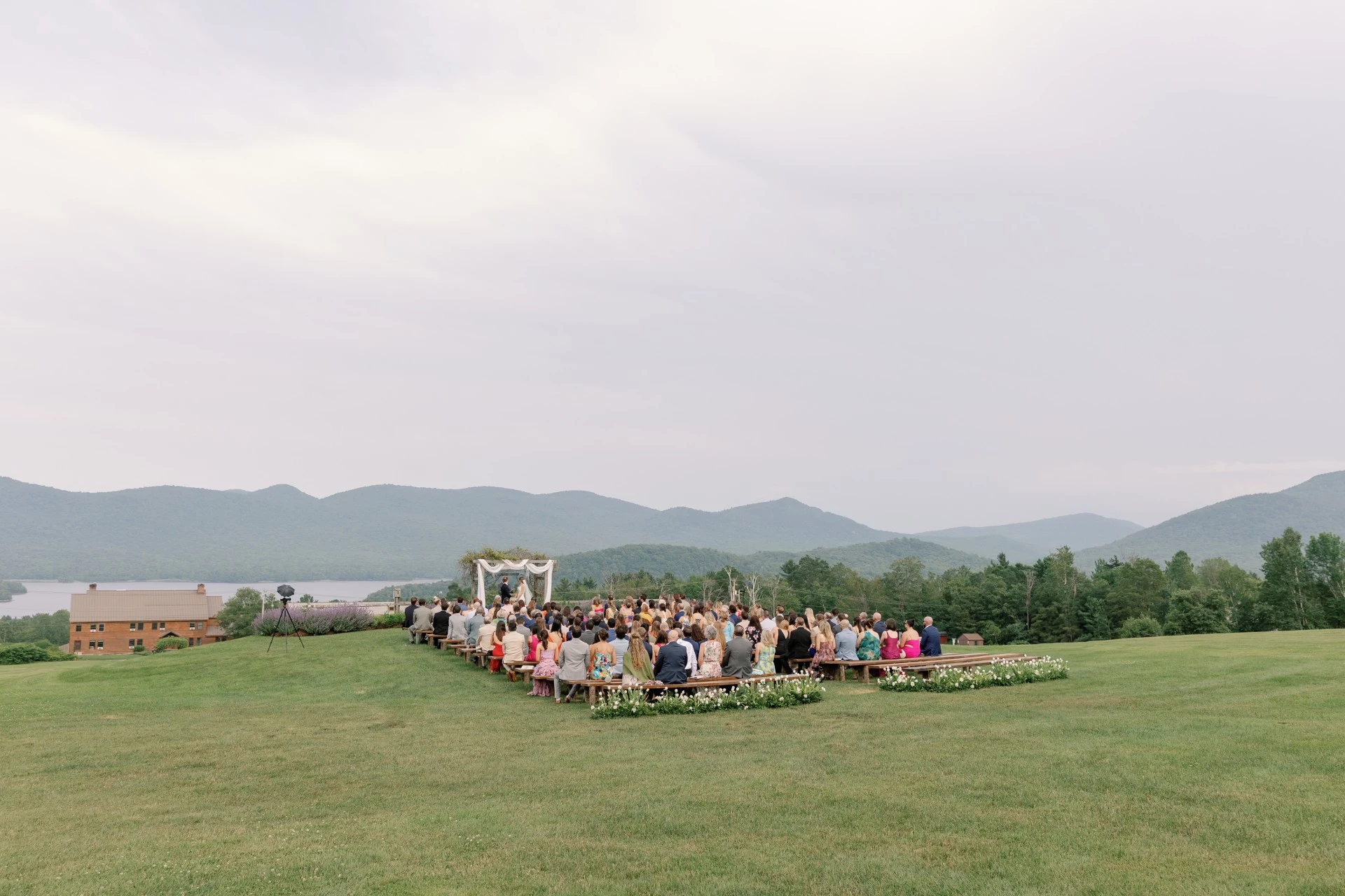 a group of people standing in a large area with a large group of people standing in a large area