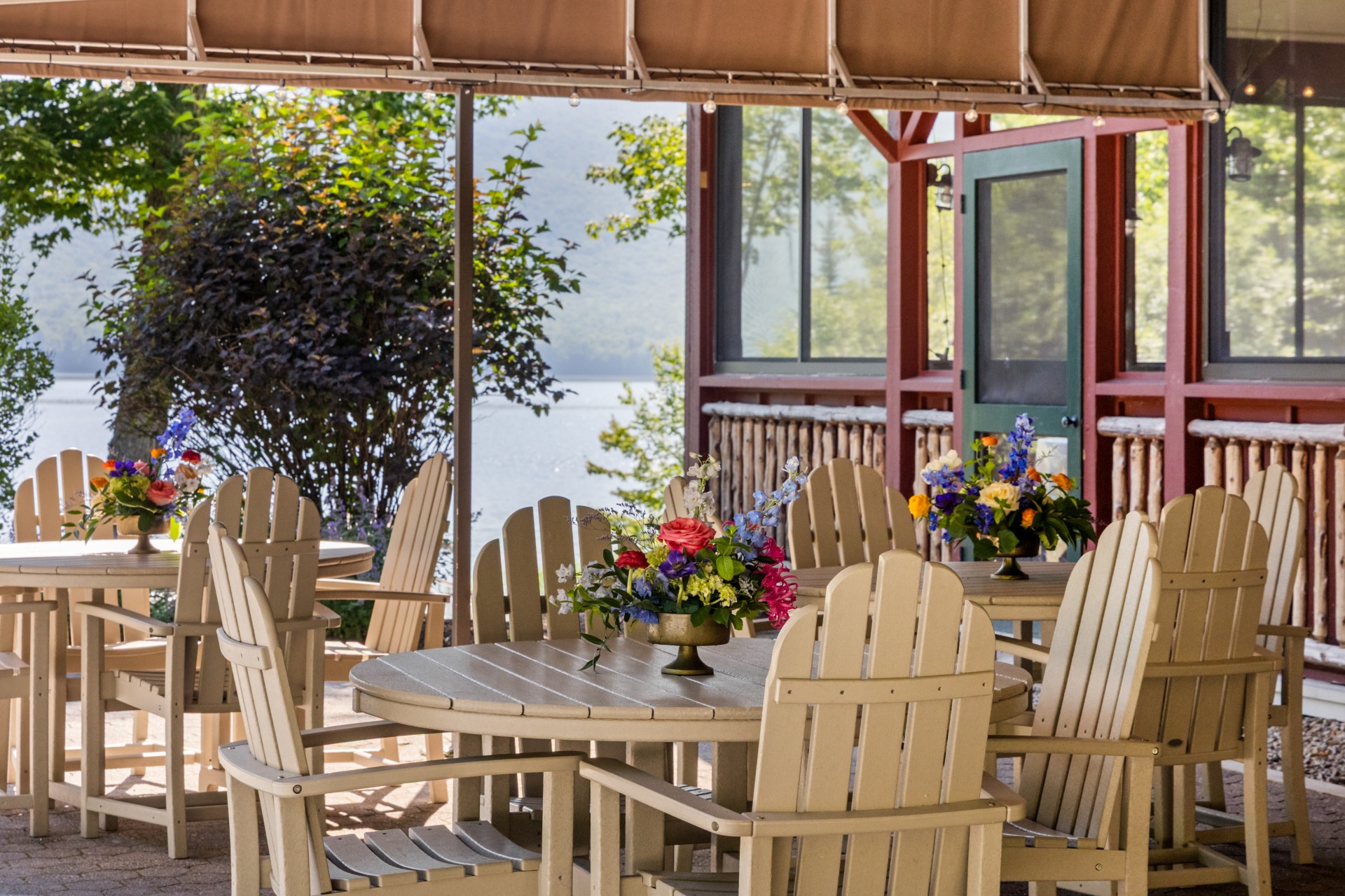 a table and chairs with flowers on it