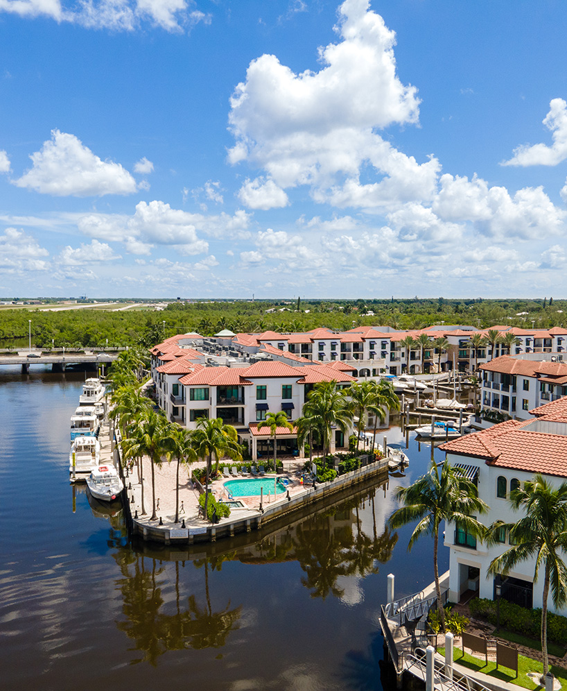 a group of buildings next to a body of water