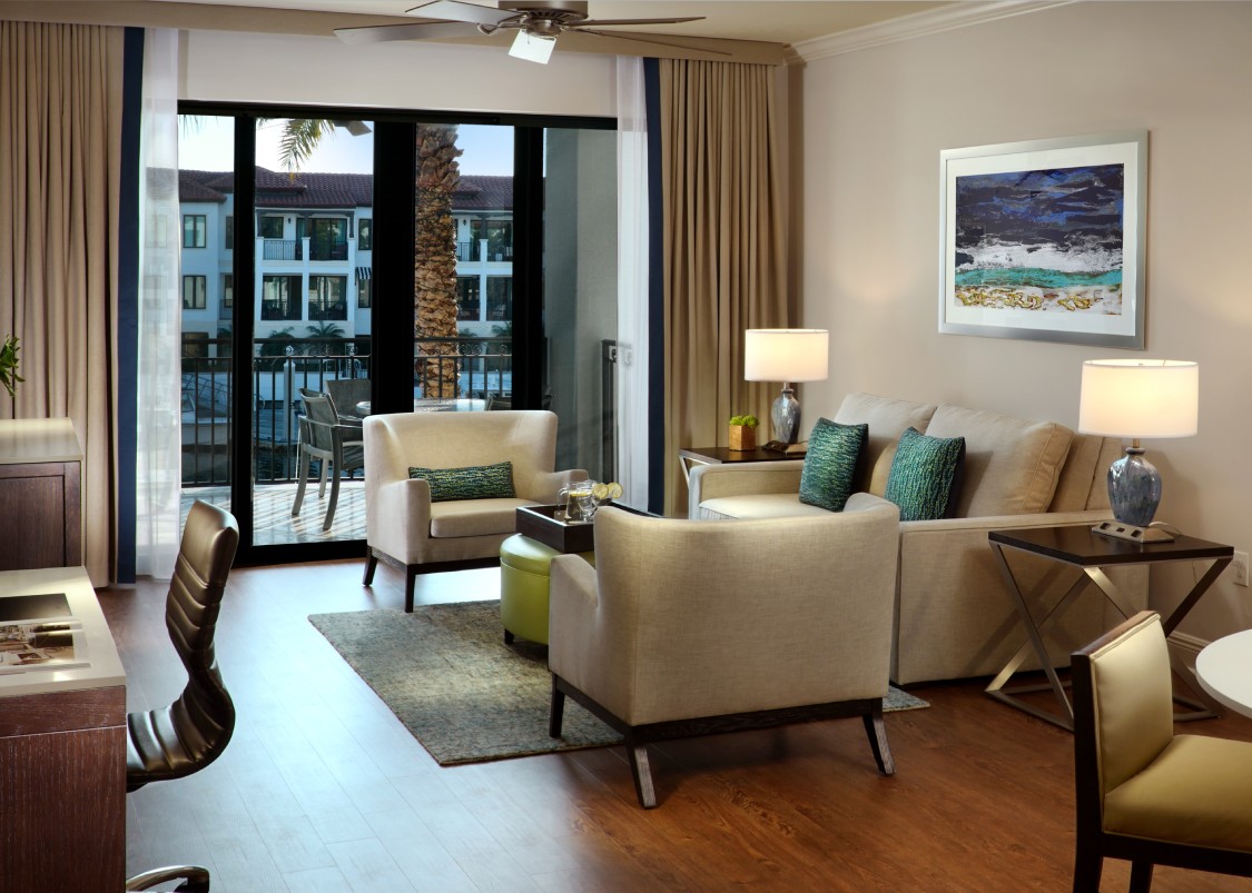 a living room with a couch and chairs