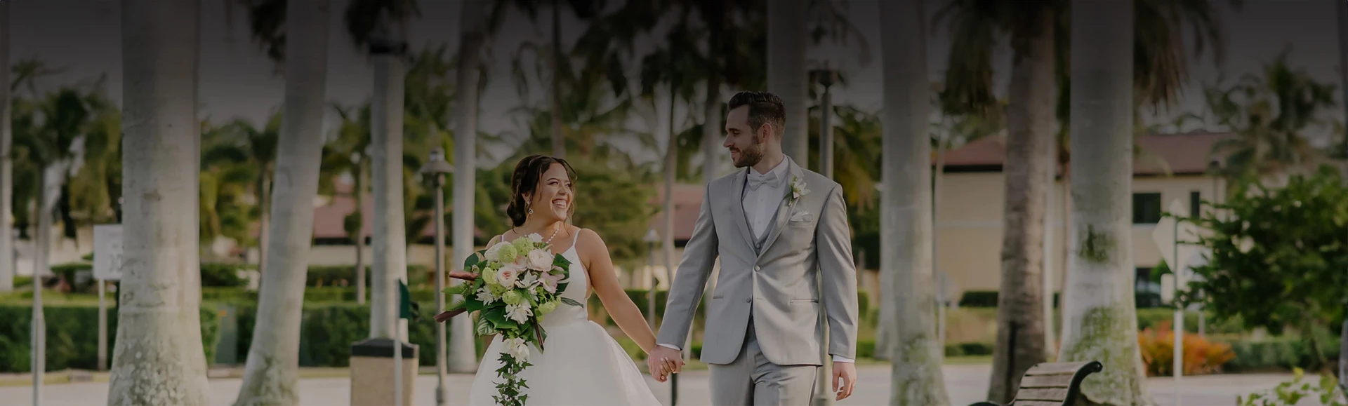 a man and woman holding hands and smiling
