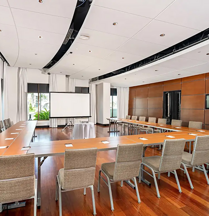 a room with a large table and chairs