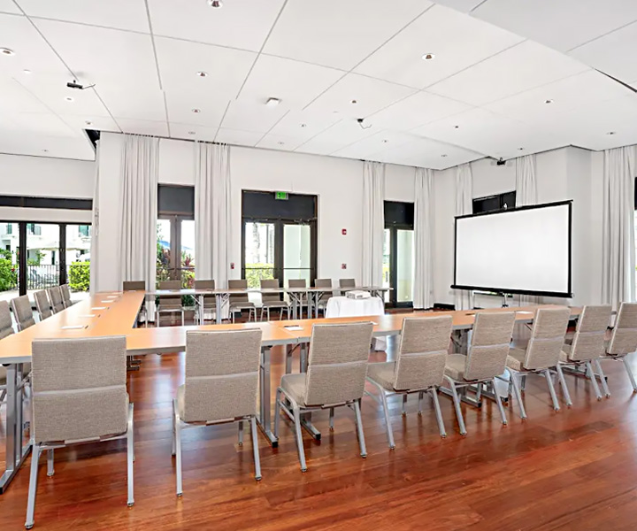 a room with a large table and chairs