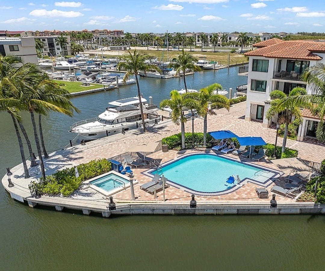 a pool and boats on the water