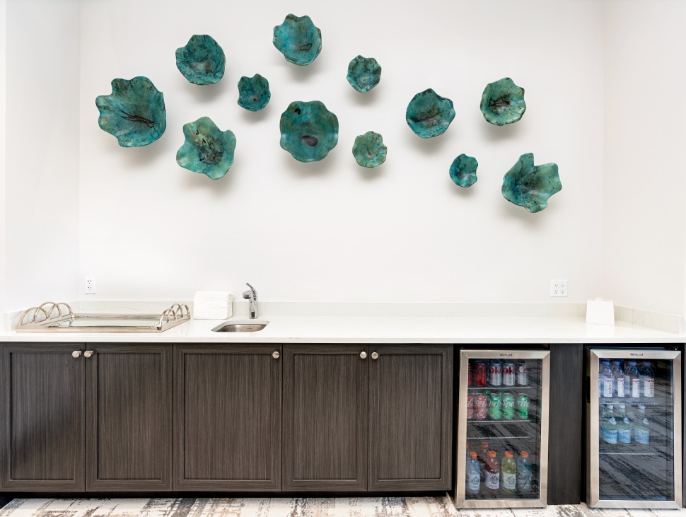 a room with a sink and a fridge
