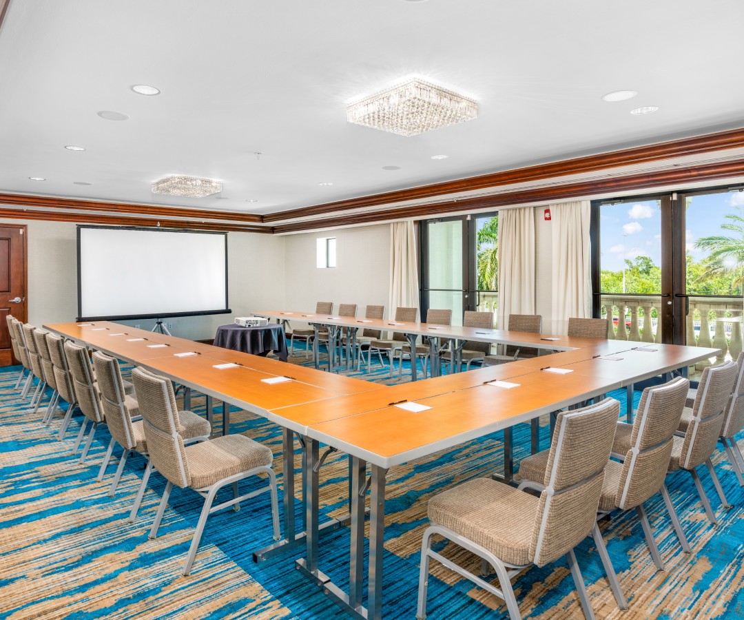 a room with a large table and chairs