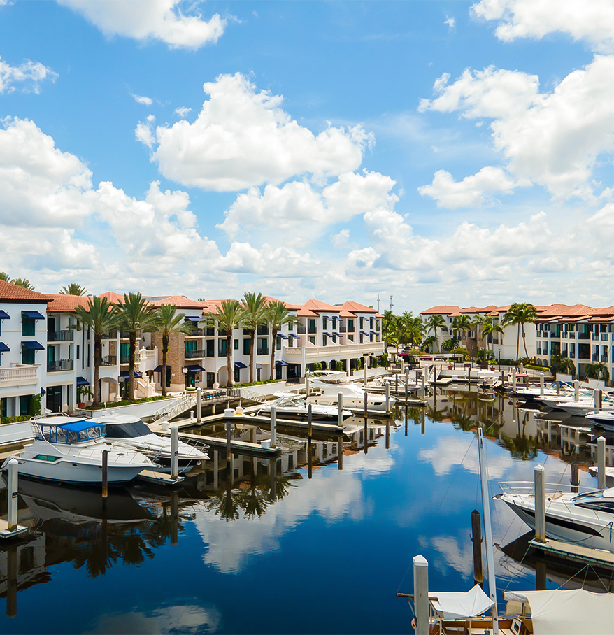 a marina with boats and buildings