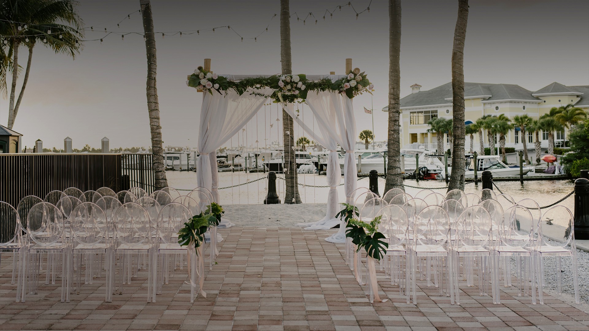 a wedding ceremony set up with chairs and flowers