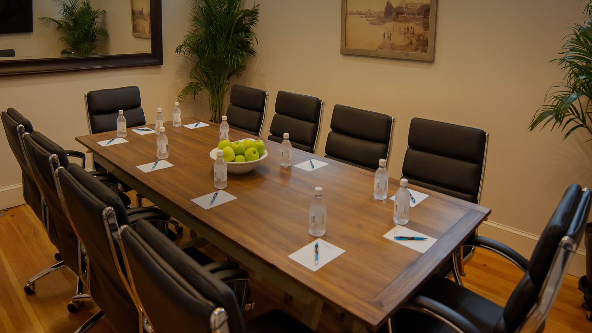 a table with water bottles and pens on it
