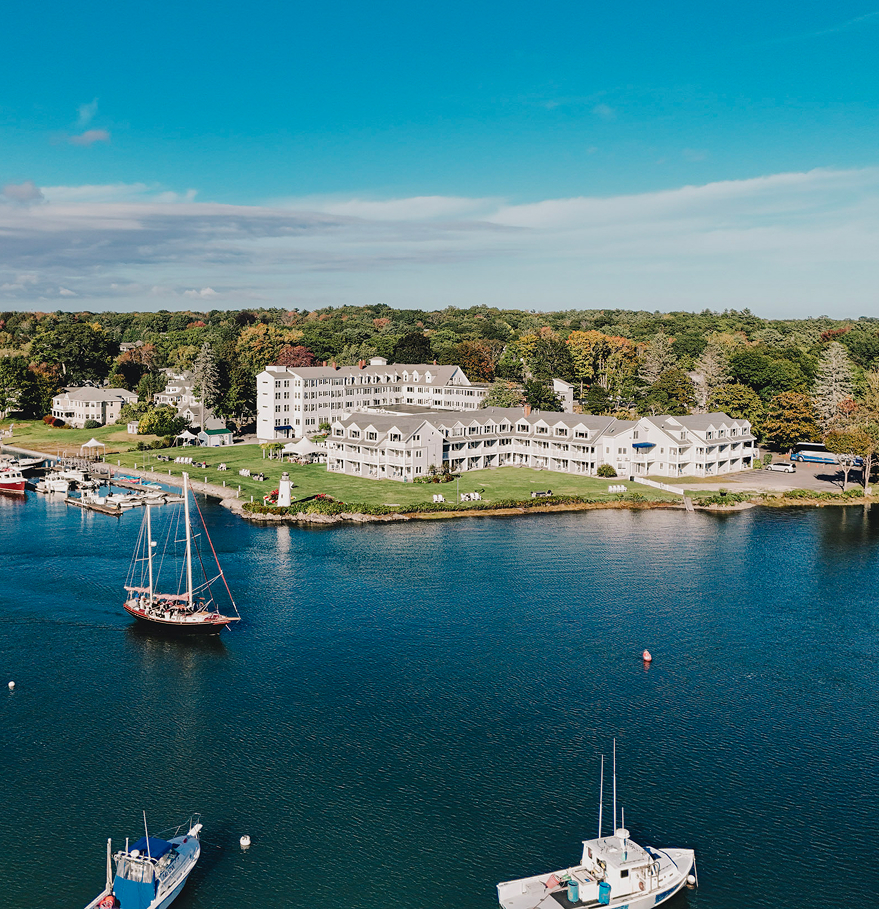 a body of water with boats and buildings in the background
