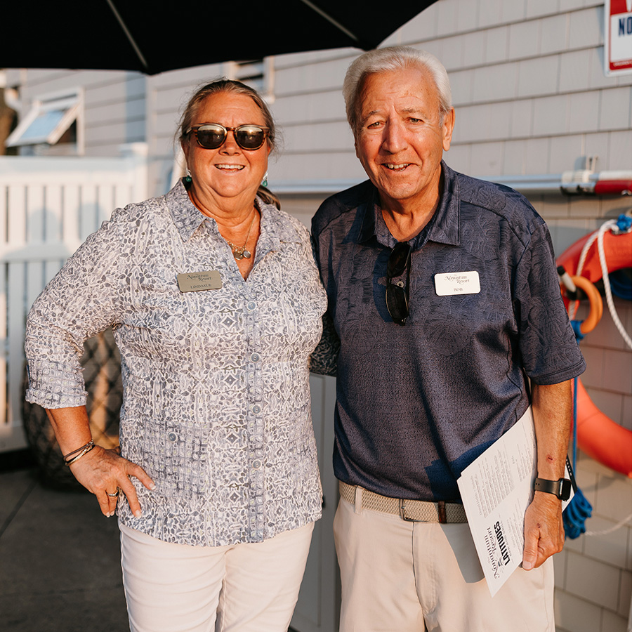 a man and woman standing next to each other