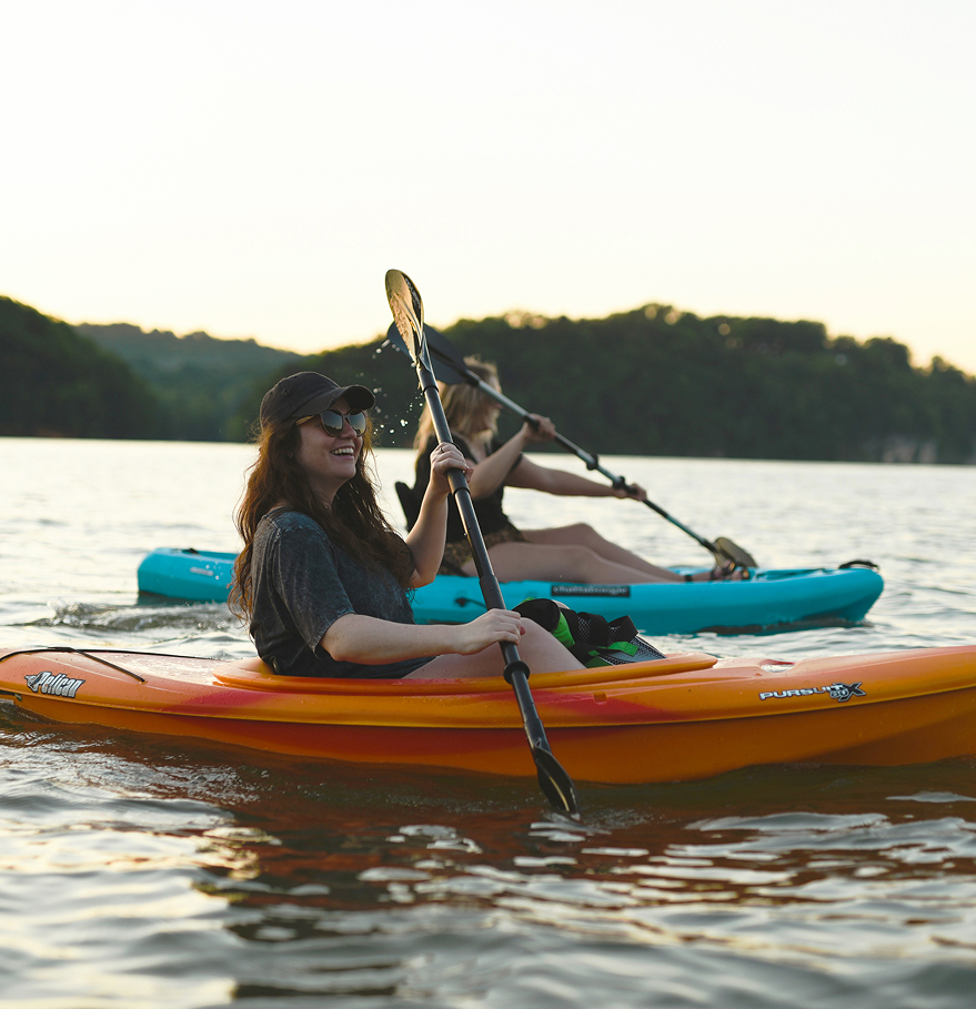 a group of people in kayaks on a lake