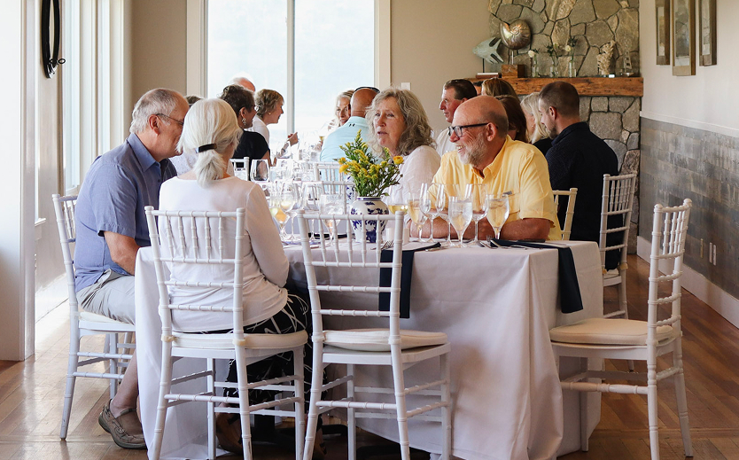 a group of people sitting at a table