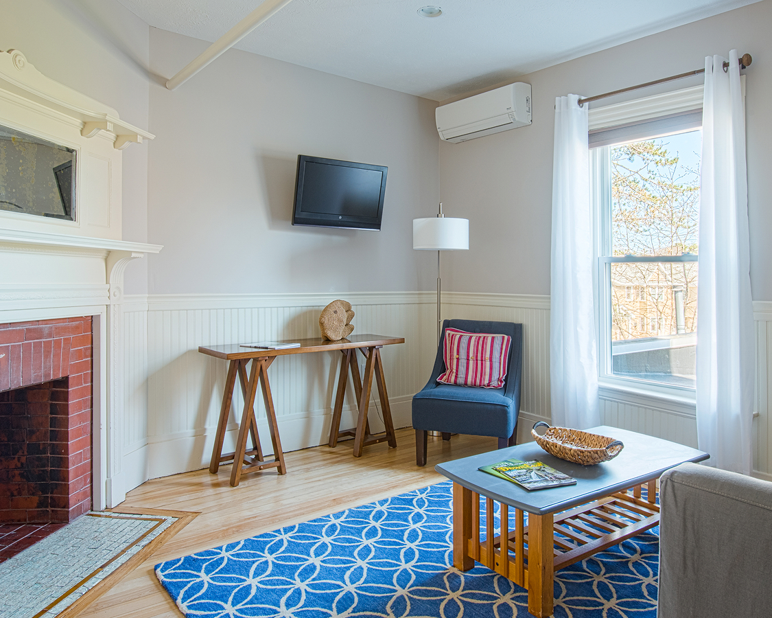 a living room with a tv and a table