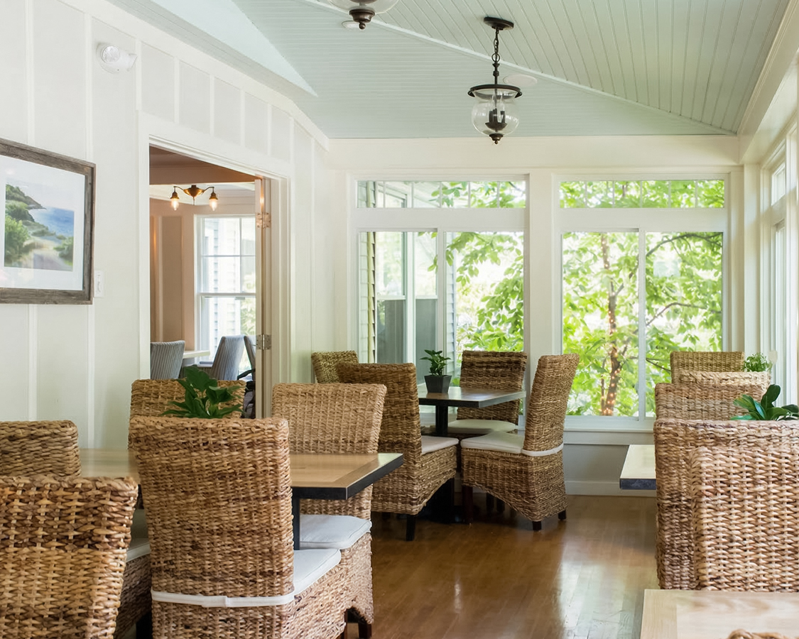 a room with wicker chairs and tables